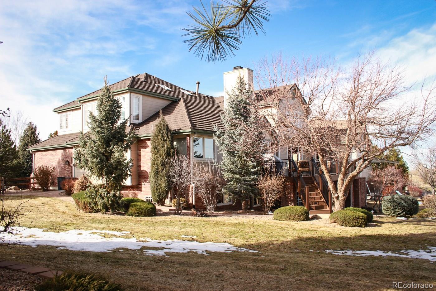 9470 Kemper Drive Lone Tree, CO 80124 - Photo 35 of 35 a front view of a house with a yard