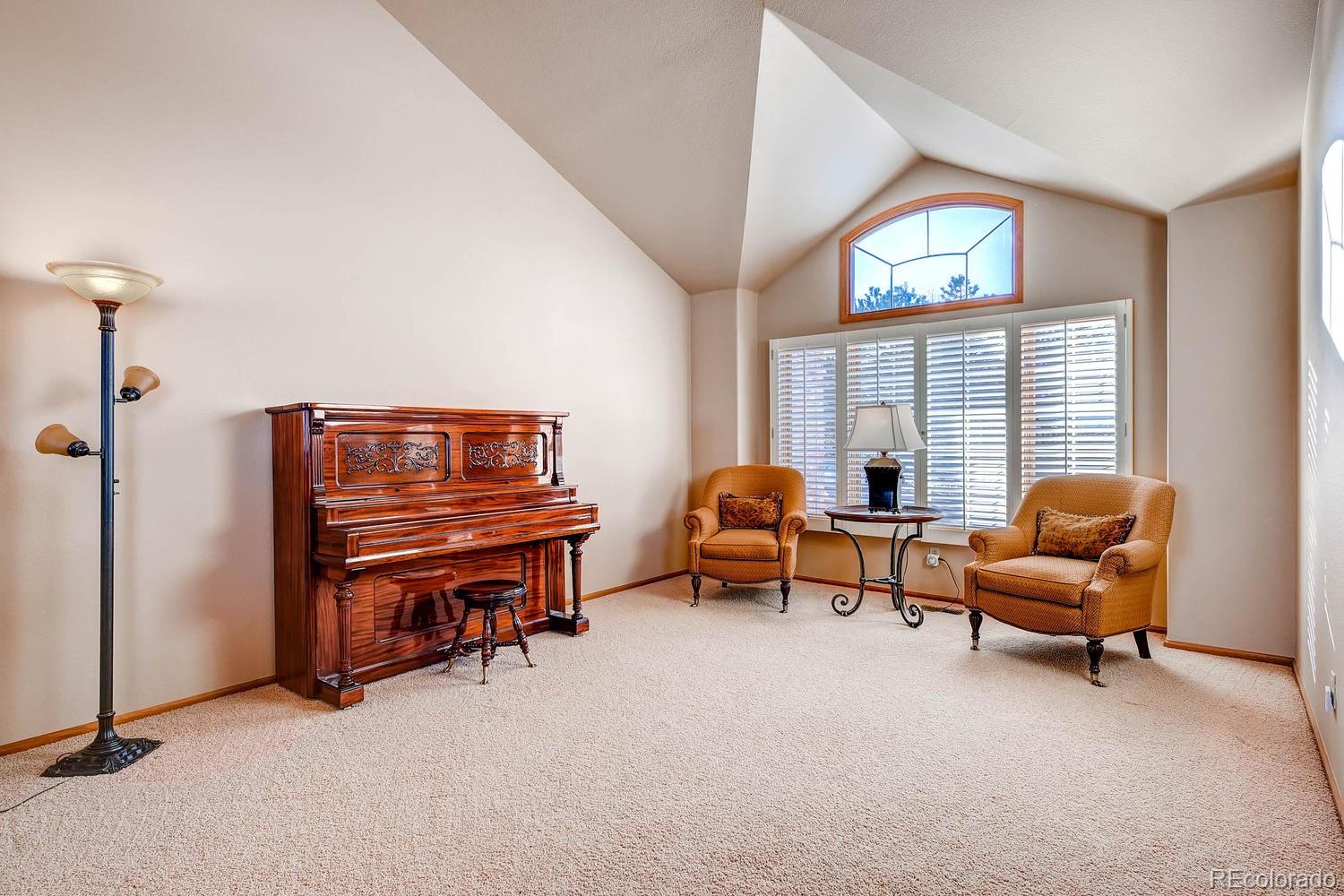 9470 Kemper Drive Lone Tree, CO 80124 - Photo 4 of 35 a living room with furniture and a window