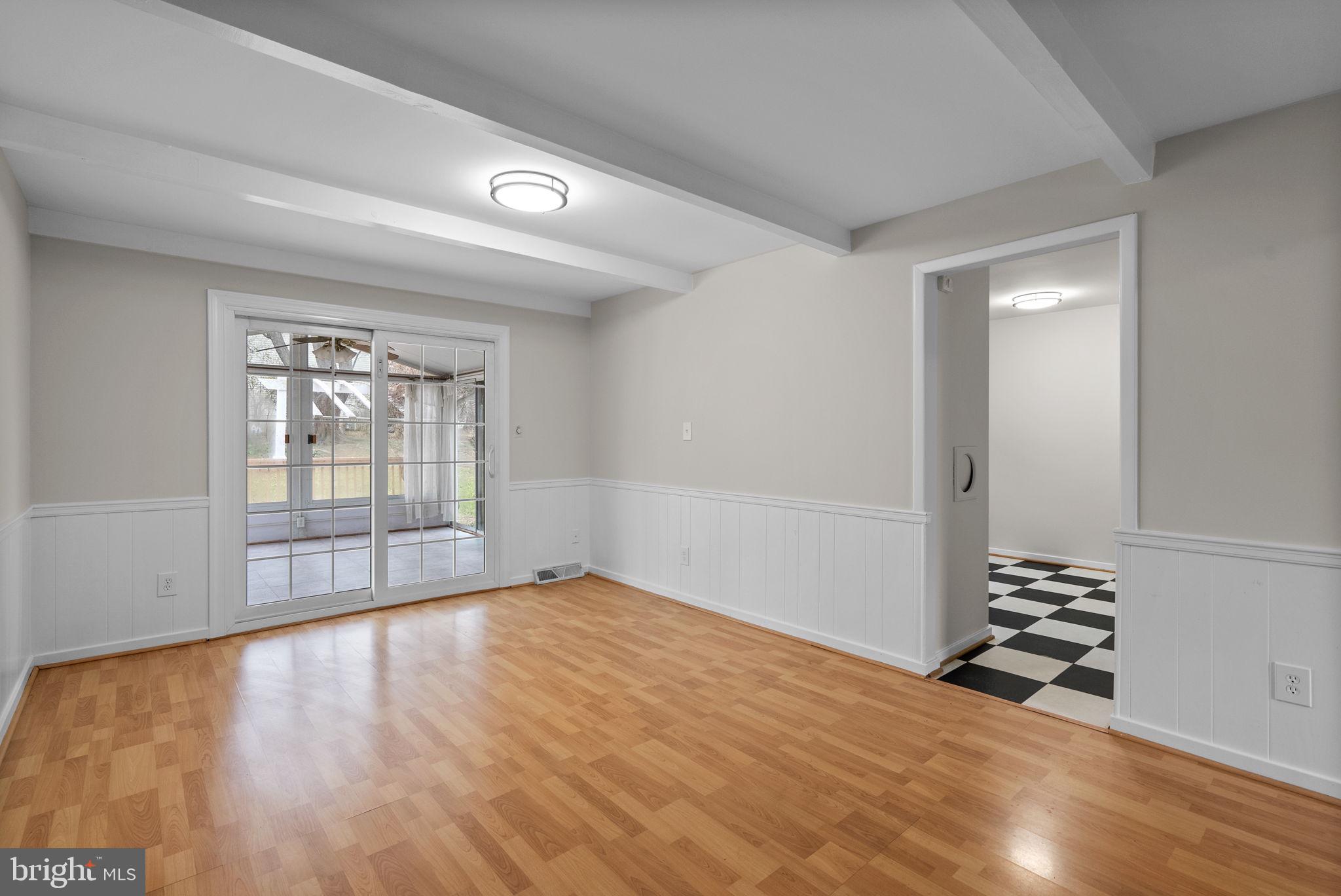 6170 Commodore Court Columbia, MD 21045 - Photo 13 of 49 a view of an empty room with wooden floor and a window