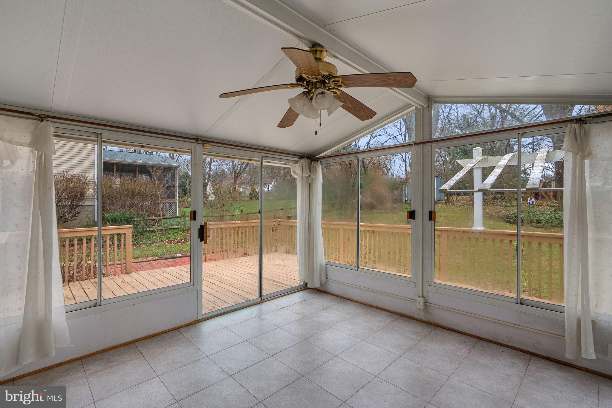 6170 Commodore Court Columbia, MD 21045 - Photo 15 of 49 a view of an empty room with a sliding door