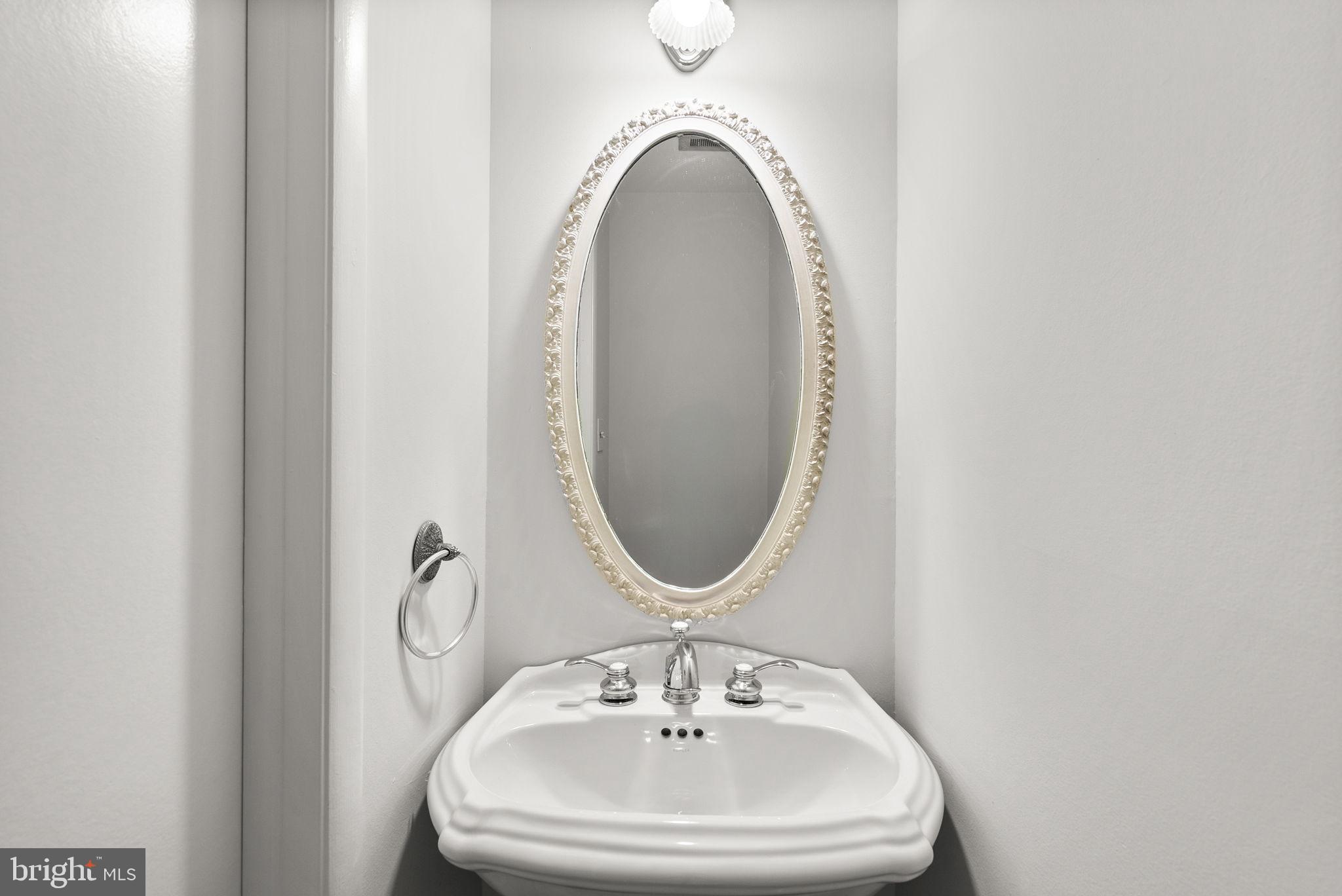 6170 Commodore Court Columbia, MD 21045 - Photo 18 of 49 a bathroom with a sink and a mirror