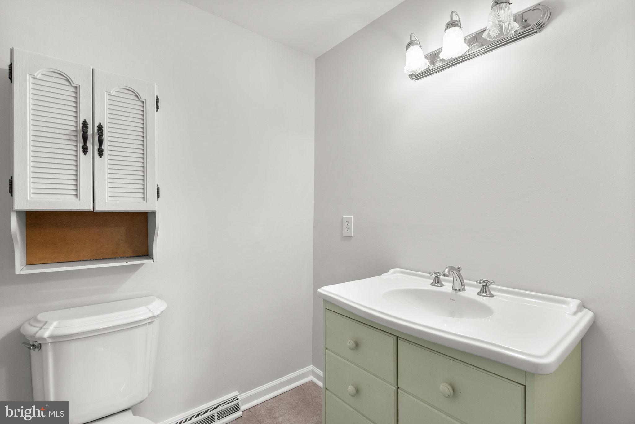 6170 Commodore Court Columbia, MD 21045 - Photo 30 of 49 a bathroom with a sink and a mirror