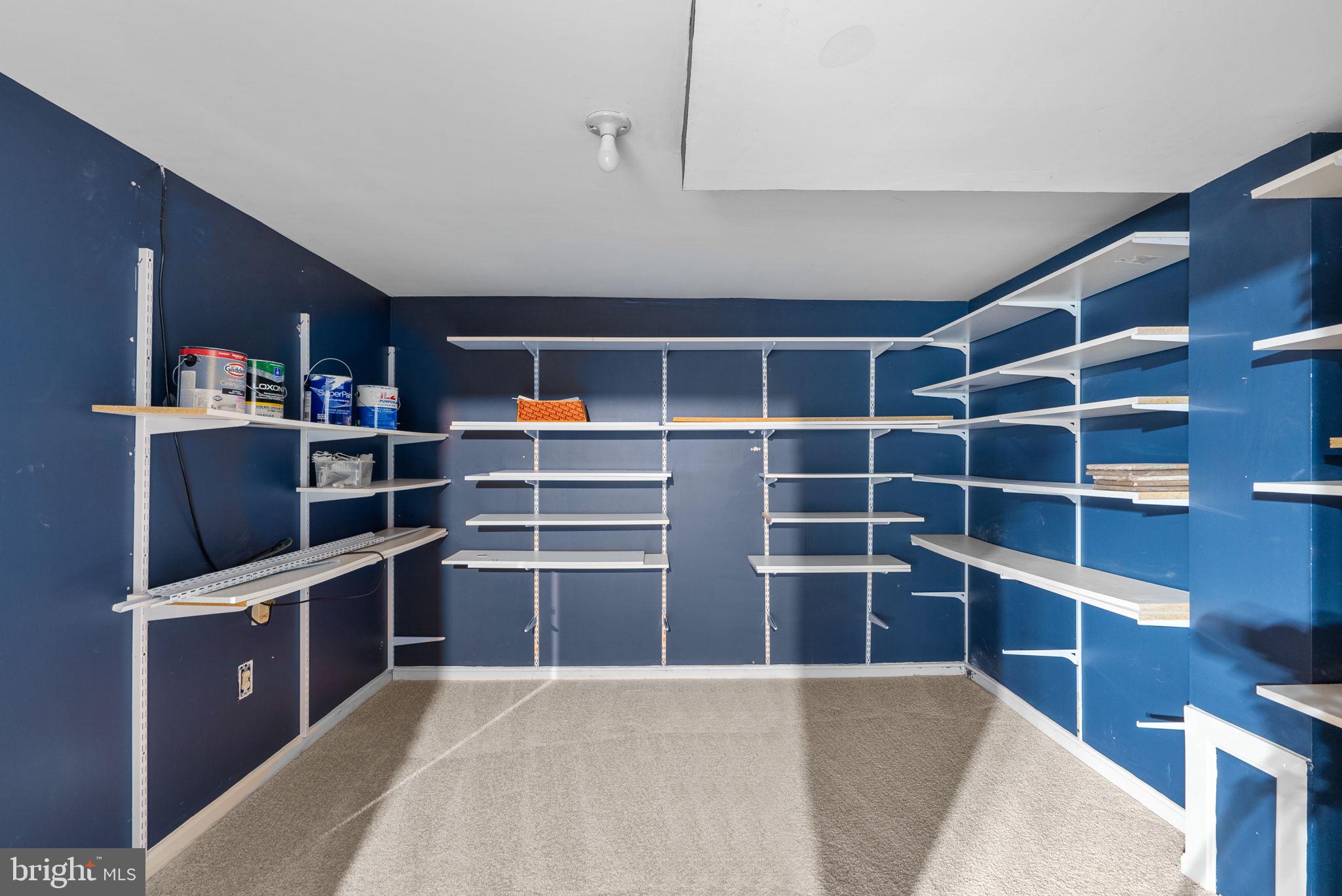 6170 Commodore Court Columbia, MD 21045 - Photo 35 of 49 a view of an empty room with empty shelves