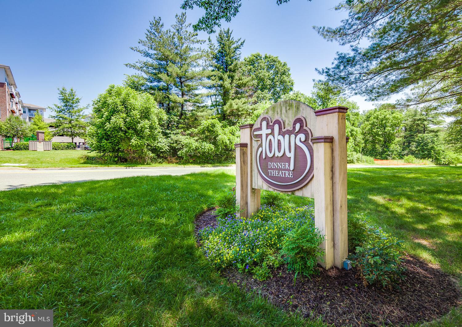 6170 Commodore Court Columbia, MD 21045 - Photo 47 of 49 a sign that is sitting in the grass near a tree