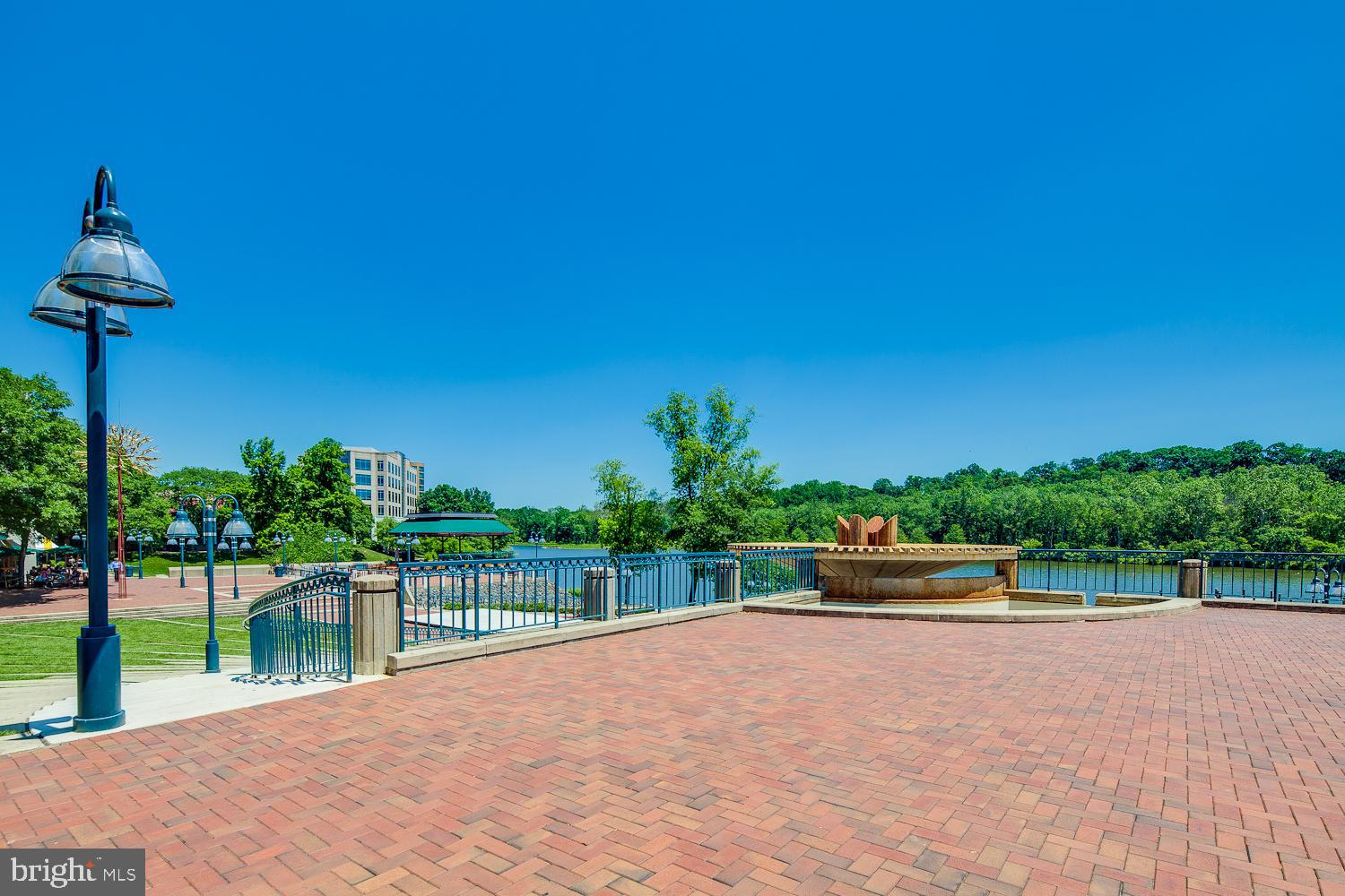 6170 Commodore Court Columbia, MD 21045 - Photo 48 of 49 a view of a swimming pool with a patio and a garden