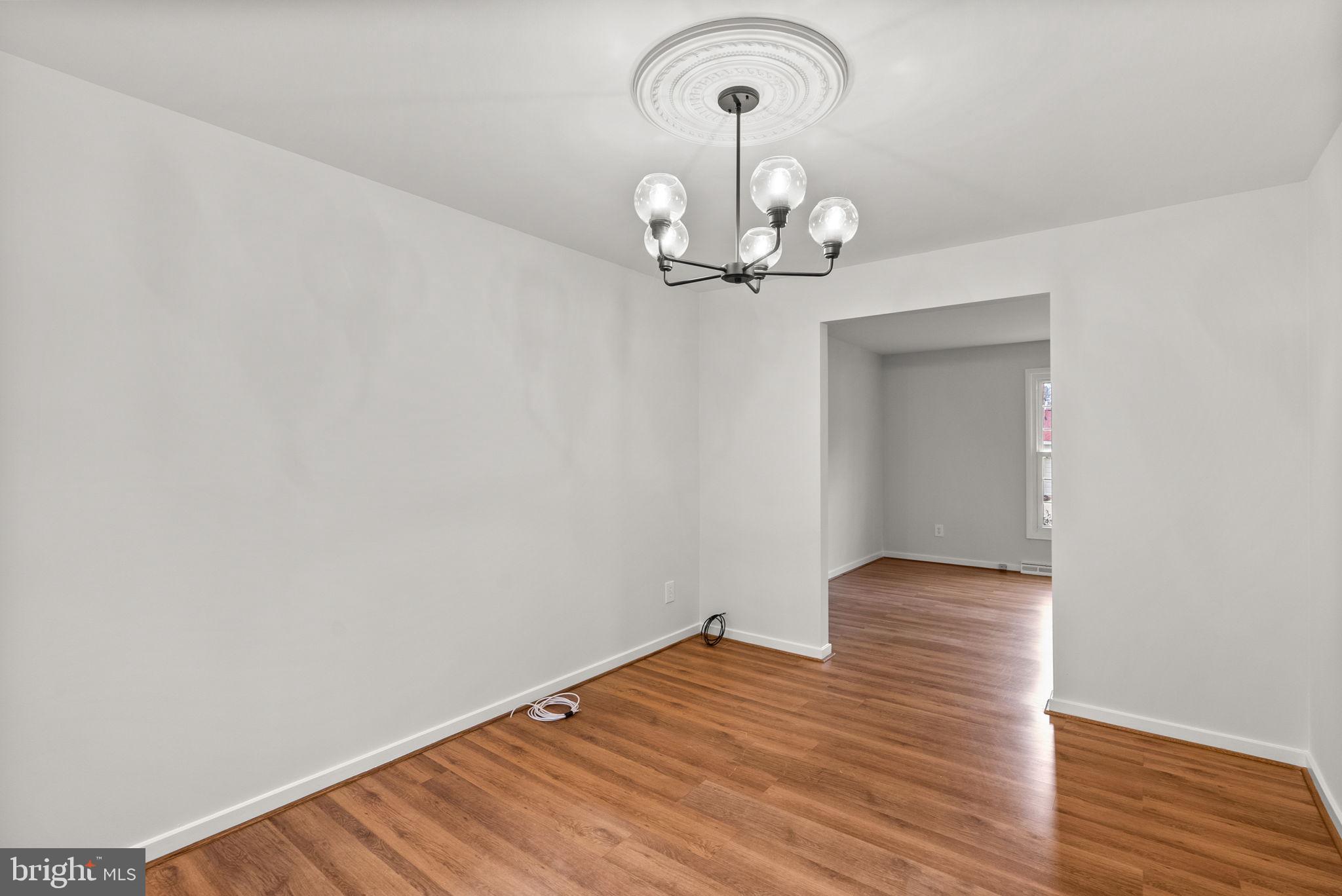 6170 Commodore Court Columbia, MD 21045 - Photo 7 of 49 a view of empty room with wooden floor