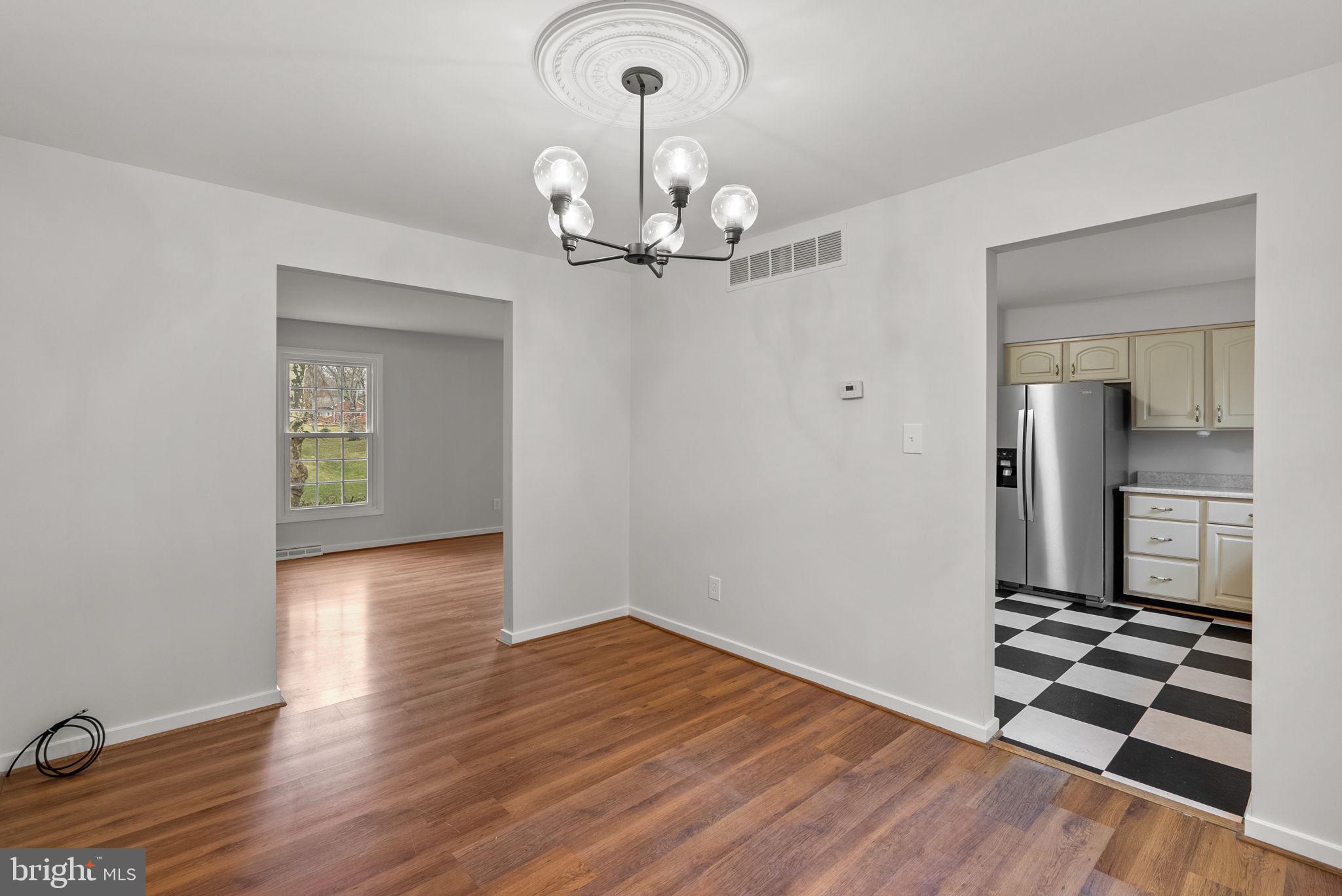 6170 Commodore Court Columbia, MD 21045 - Photo 8 of 49 wooden floor in an empty room with a window