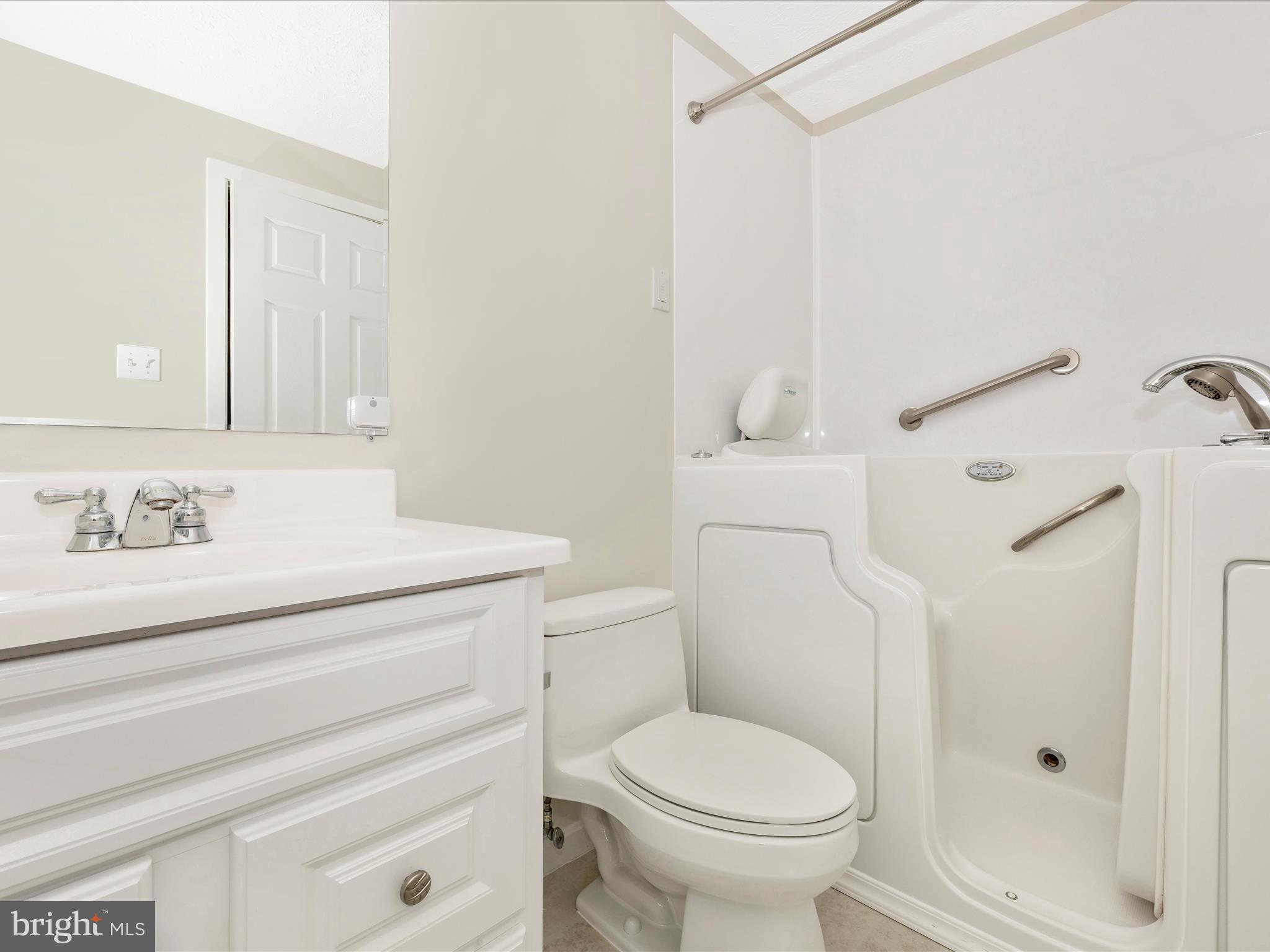 595 Old Stage Road Frederick, MD 21703 - Photo 32 of 43 a bathroom with a sink a toilet and shower