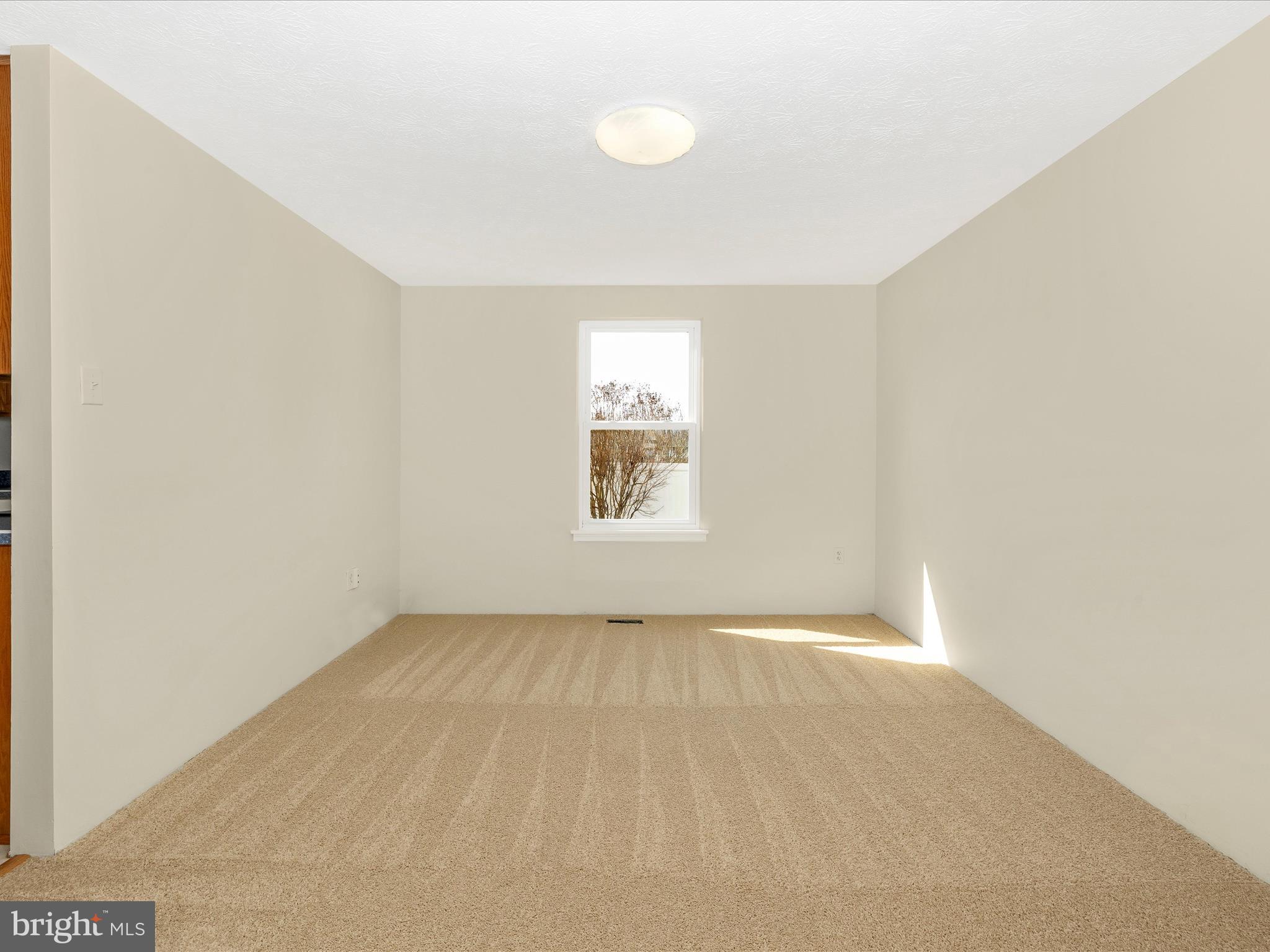 595 Old Stage Road Frederick, MD 21703 - Photo 10 of 43 a view of an empty room with a window