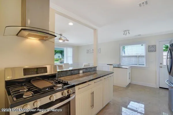 a kitchen with a stove and a sink