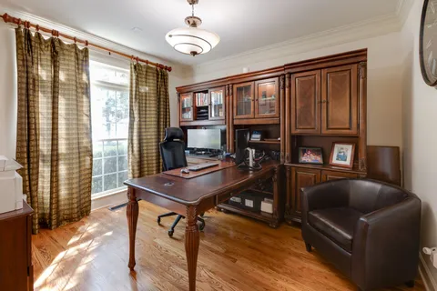 a large kitchen with a table and chairs