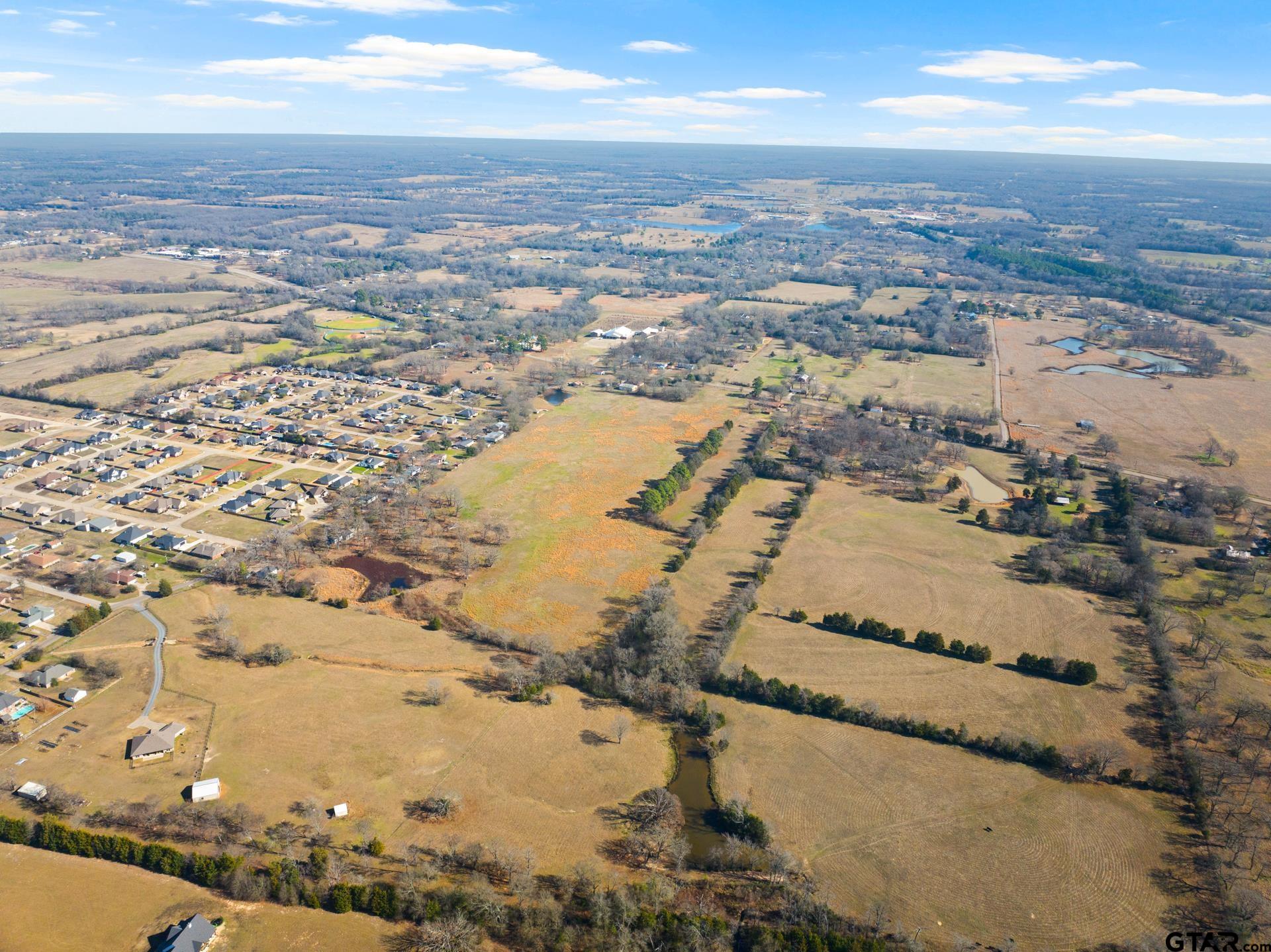 1402 And Nevills Road Mount Pleasant, TX 75455 - Photo 11 of 31 an aerial view of ocean and residential houses with outdoor space