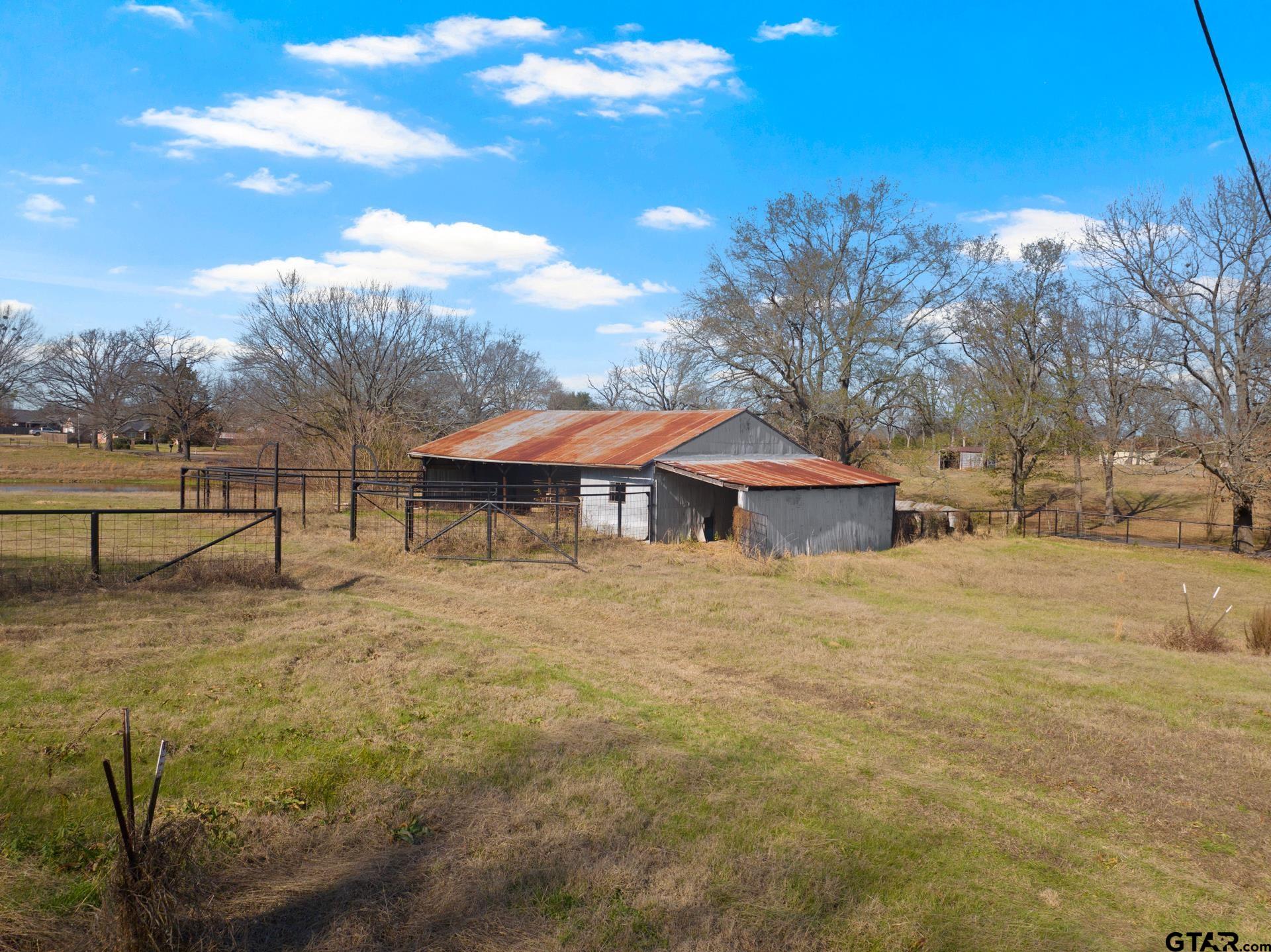 1402 And Nevills Road Mount Pleasant, TX 75455 - Photo 24 of 31 a view of a house with a yard