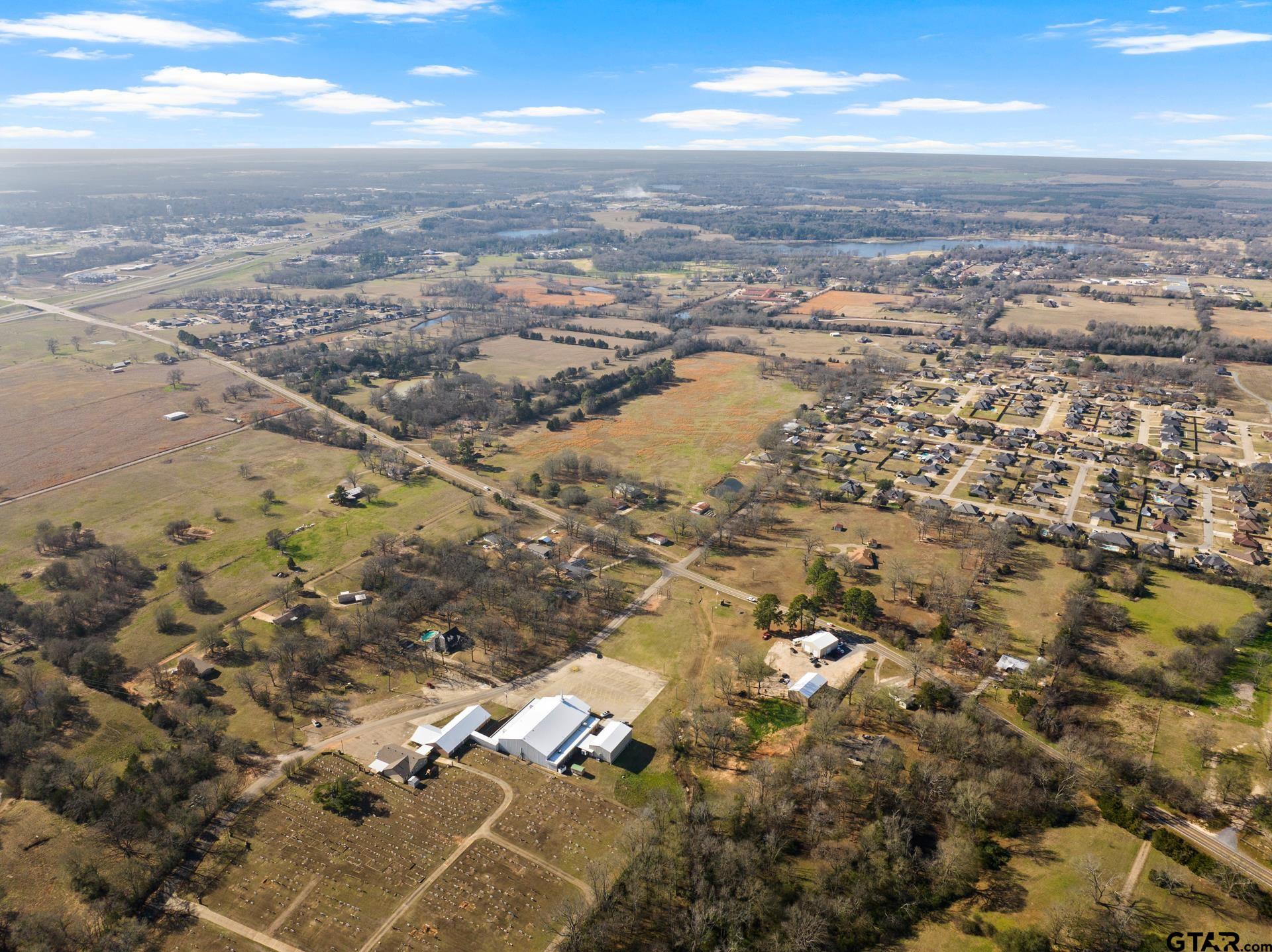 1402 And Nevills Road Mount Pleasant, TX 75455 - Photo 9 of 31 an aerial view of residential building with parking space