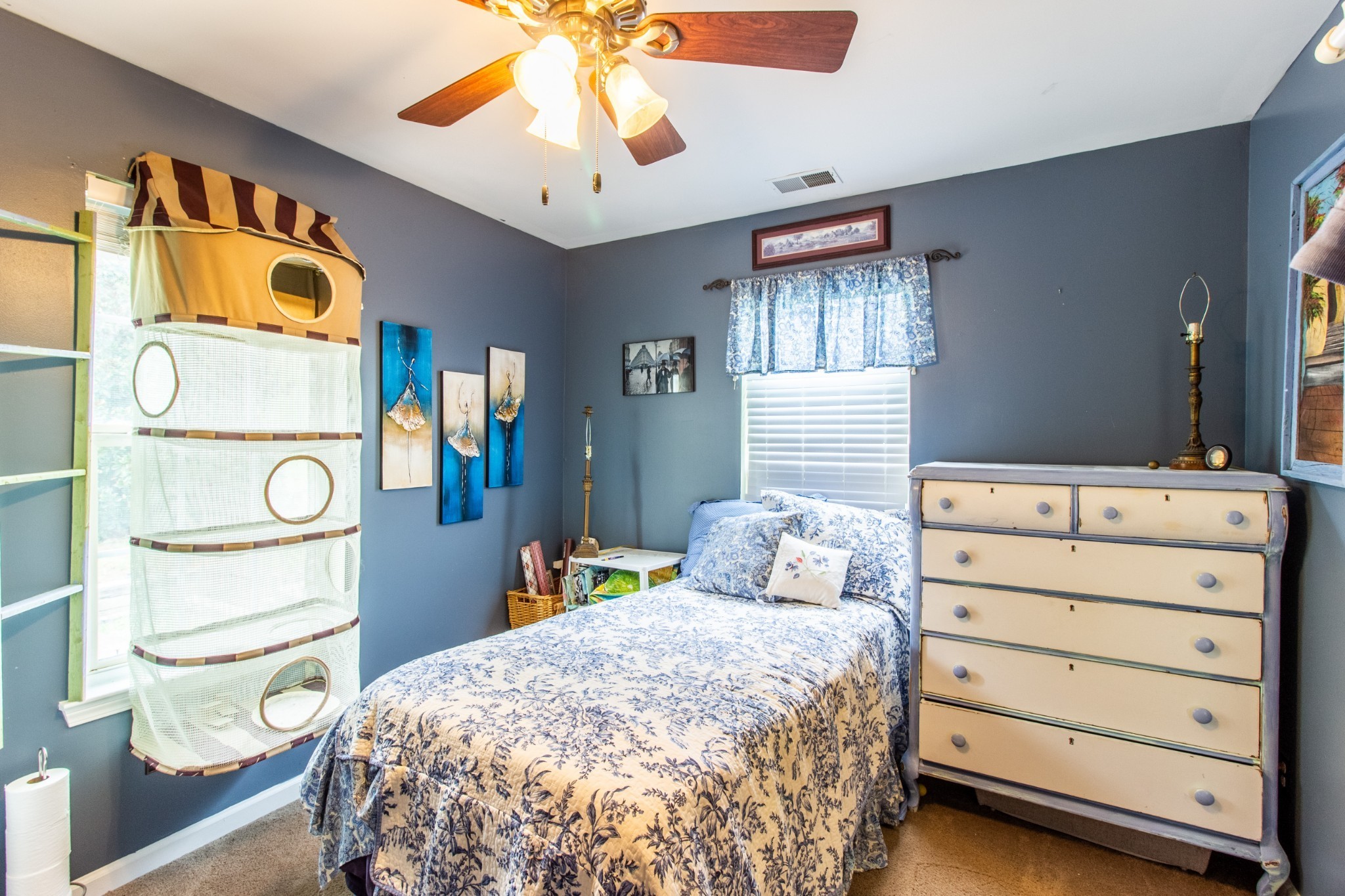 1371 Cowan Road Dickson, TN 37055 - Photo 11 of 18 a bedroom with a bed and a chandelier