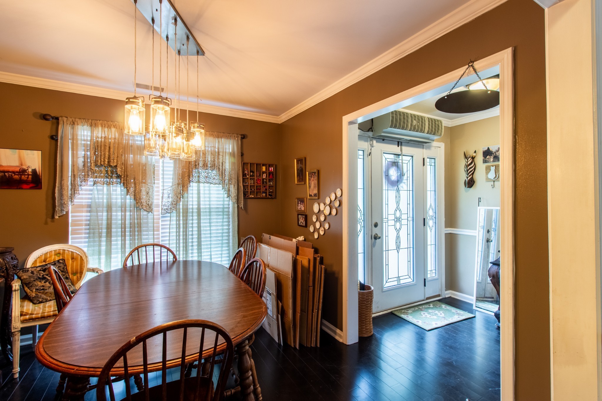 1371 Cowan Road Dickson, TN 37055 - Photo 4 of 18 a view of a dining room with furniture a chandelier and wooden floor