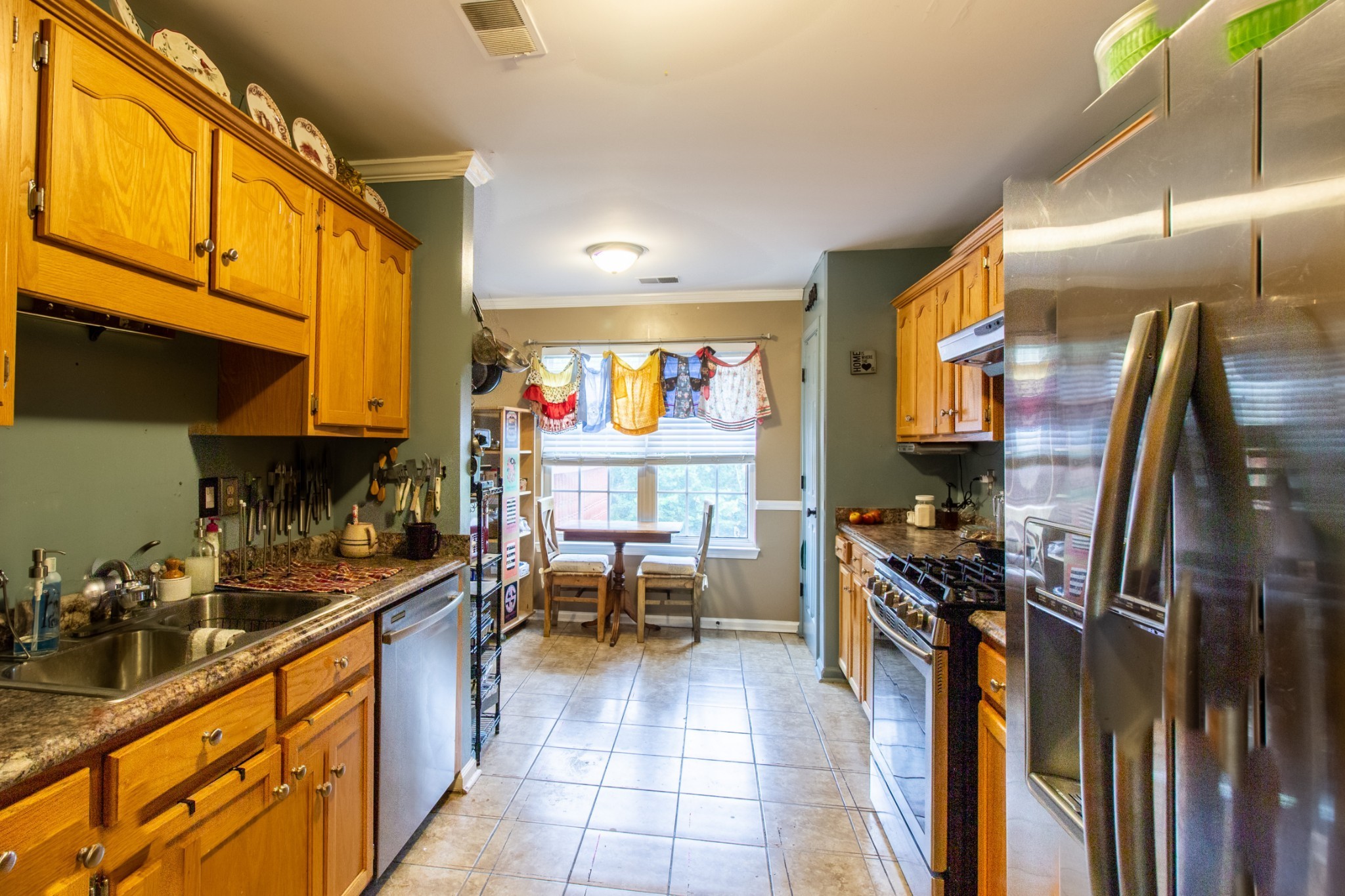 1371 Cowan Road Dickson, TN 37055 - Photo 7 of 18 a kitchen with stainless steel appliances a sink counter space and a window