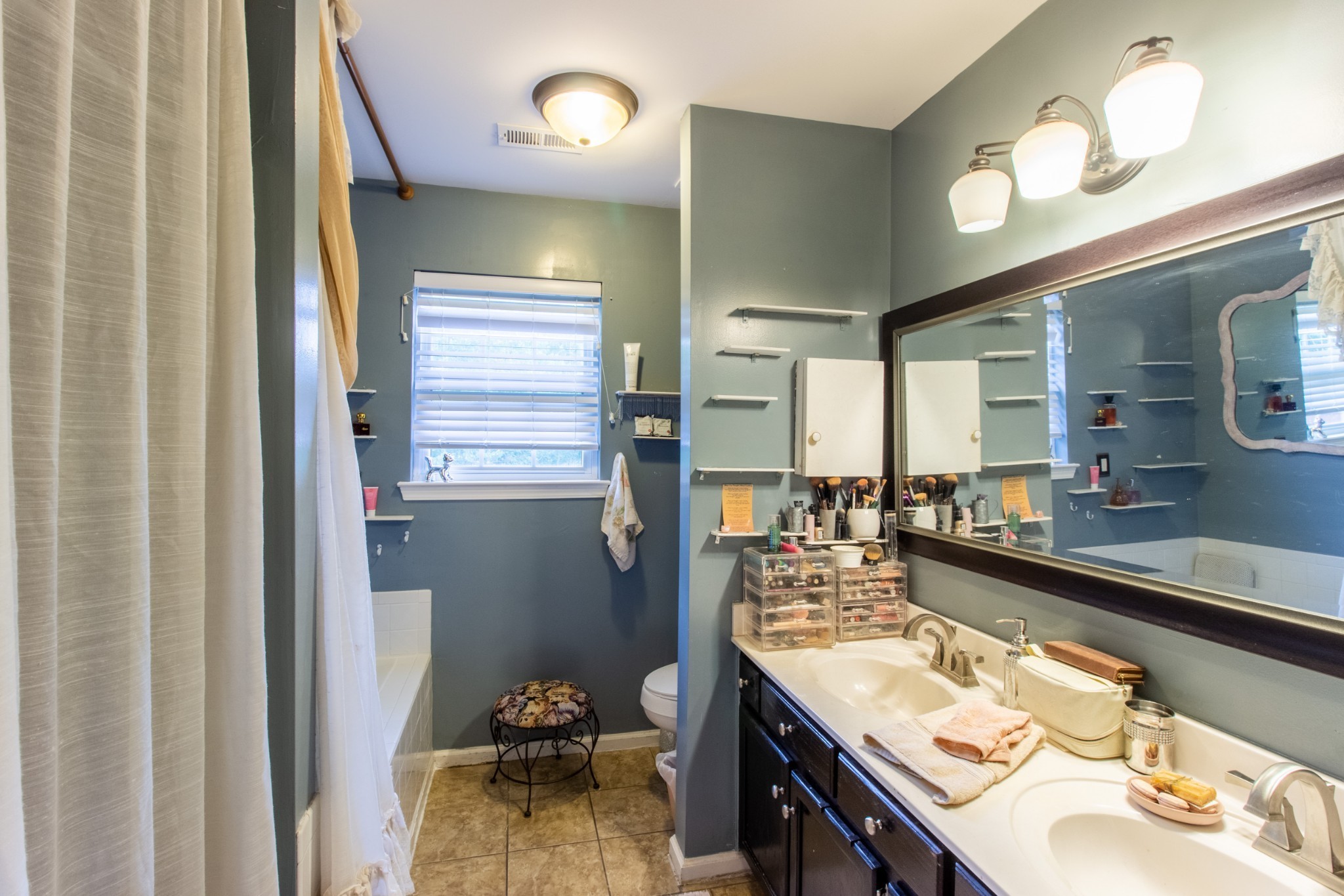 1371 Cowan Road Dickson, TN 37055 - Photo 9 of 18 a bathroom with a sink vanity granite and a mirror