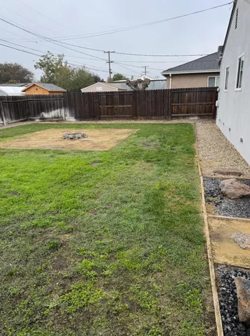a view of a yard and front of the house