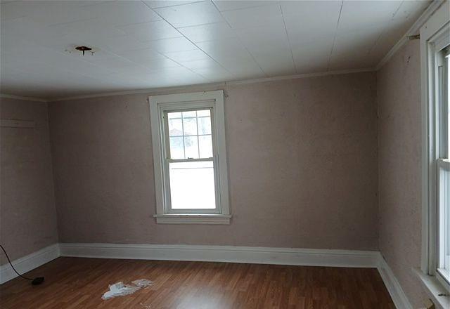 511 4th Avenue New Eagle, PA 15067 - Photo 9 of 14 an empty room with wooden floor and windows
