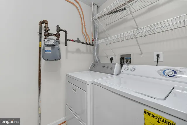 a spacious bedroom with a bed and a couch