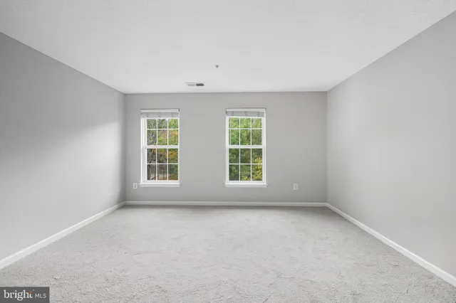 a spacious bedroom with a bed and a couch