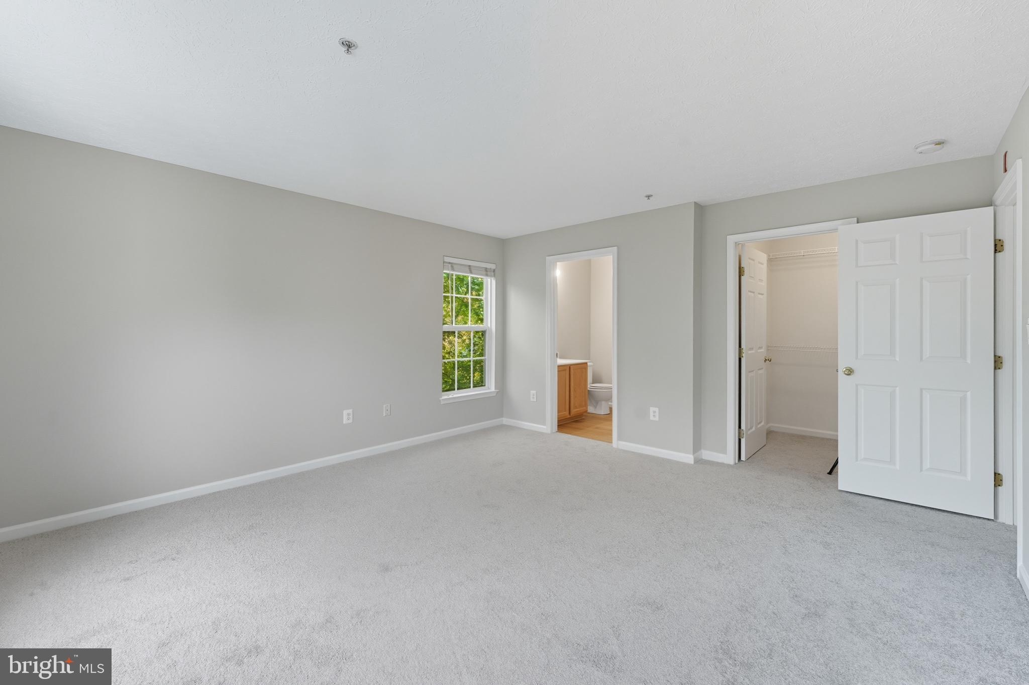 25910 Ridge Manor Drive, Unit 1000L Damascus, MD 20872 - Photo 32 of 51 Primary Bedroom Suite