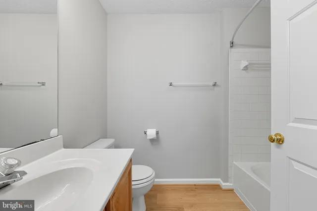 a bedroom with bed and a window