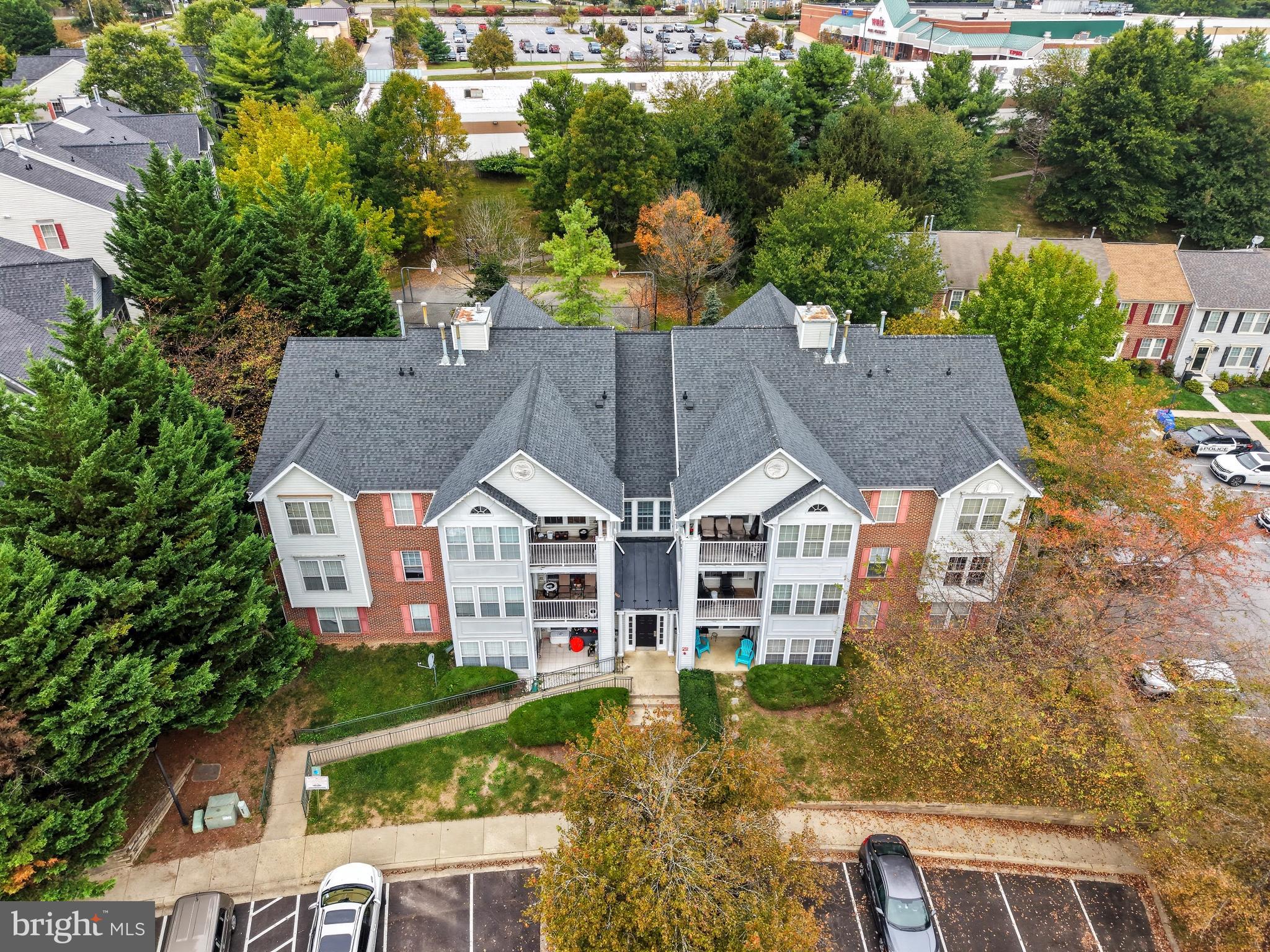 25910 Ridge Manor Drive, Unit 1000L Damascus, MD 20872 - Photo 4 of 51 Charming residential complex with lush greenery.