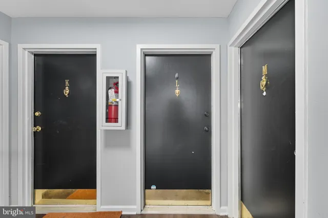 a living room with furniture a flat screen tv and a large window