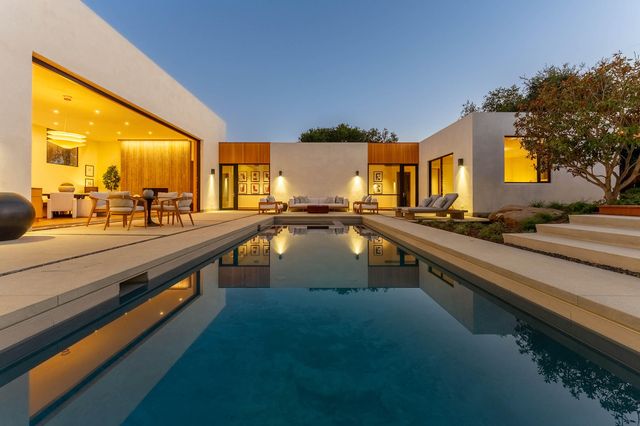 a view of swimming pool from a balcony