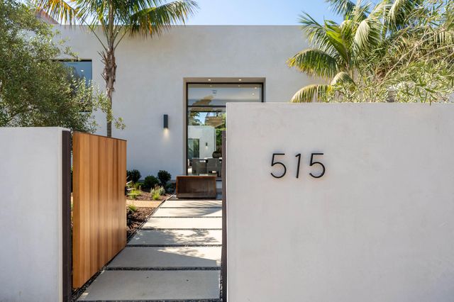 a living room with fireplace furniture and a large window