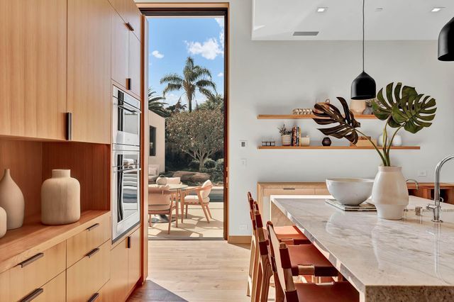 a kitchen with a stove and a cabinet