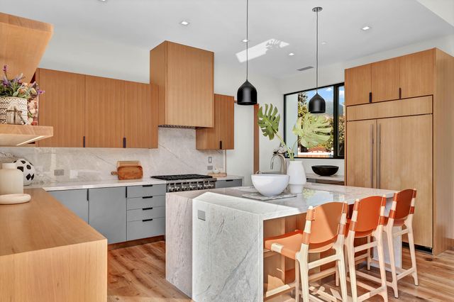 a view of a living room with a floor to ceiling window