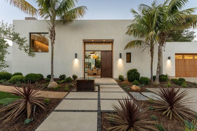 a view of a house with balcony and patio