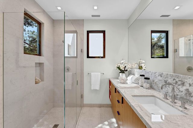 a living room with furniture and a lamp