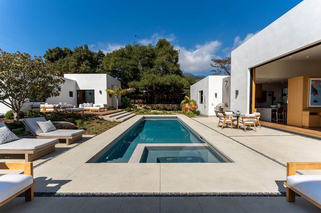 a kitchen that has a sink and a stove