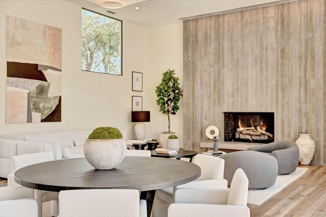 a living room with furniture a lamp and a fireplace