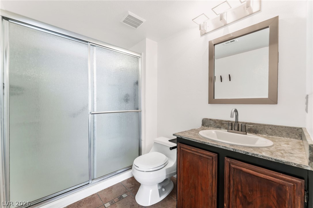 1901 Rio Canyon Court, Unit 102 Las Vegas, NV 89128 - Photo 14 of 23 Functional full bathroom with shower and vanity featuring ample counter space and storage.