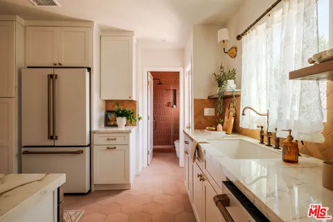 a kitchen with a stove and a sink