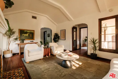 a living room with furniture and a table