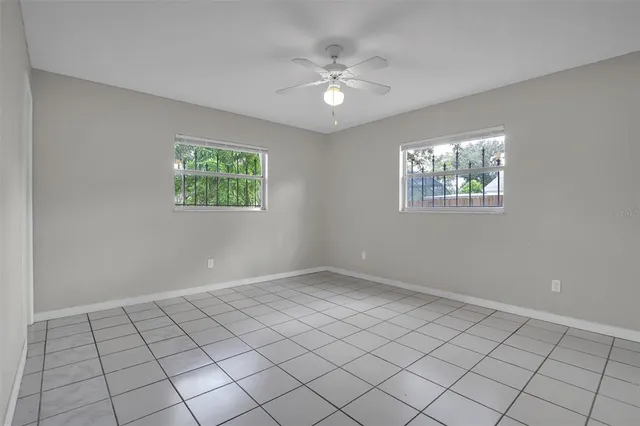 a view of an empty room with windows