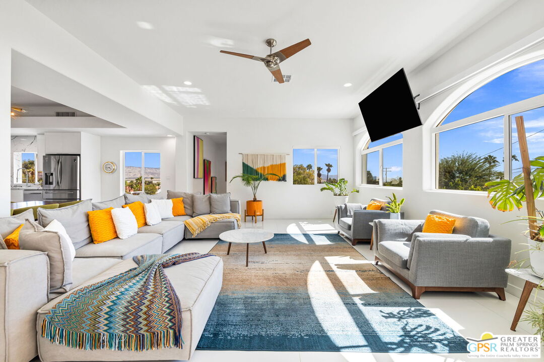 775 West Racquet Club Road Palm Springs, CA 92262 - Photo 17 of 38 a living room with furniture and a flat screen tv