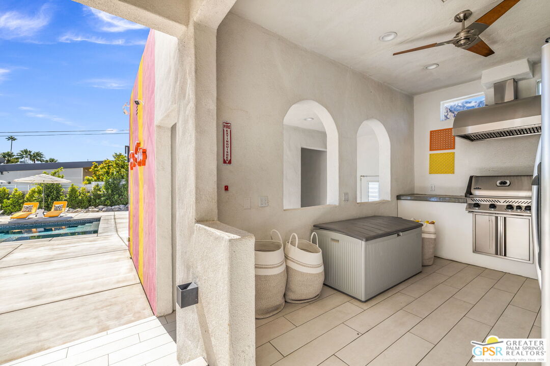 775 West Racquet Club Road Palm Springs, CA 92262 - Photo 20 of 38 a living room with furniture and a open kitchen view