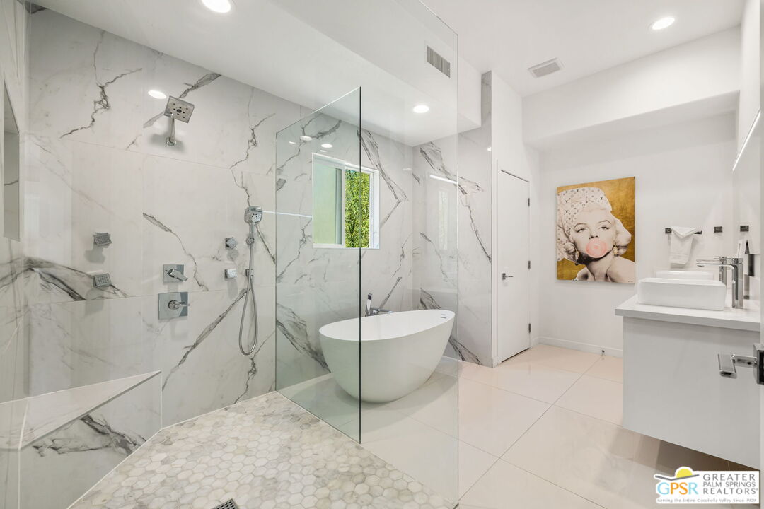 775 West Racquet Club Road Palm Springs, CA 92262 - Photo 23 of 38 a spacious bathroom with a sink a toilet and shower