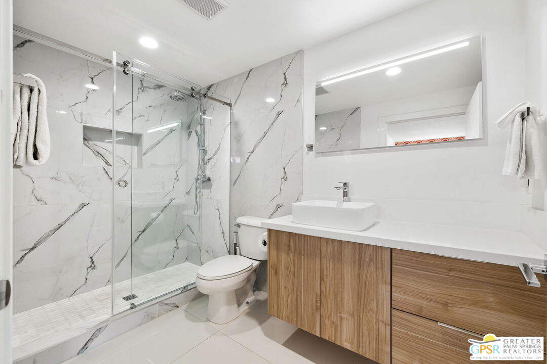 775 West Racquet Club Road Palm Springs, CA 92262 - Photo 35 of 38 a bathroom with a sink toilet and shower