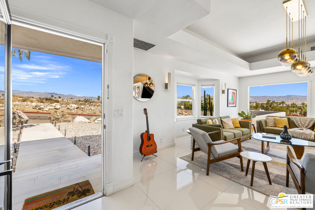 775 West Racquet Club Road Palm Springs, CA 92262 - Photo 8 of 38 a living room with furniture and a large window