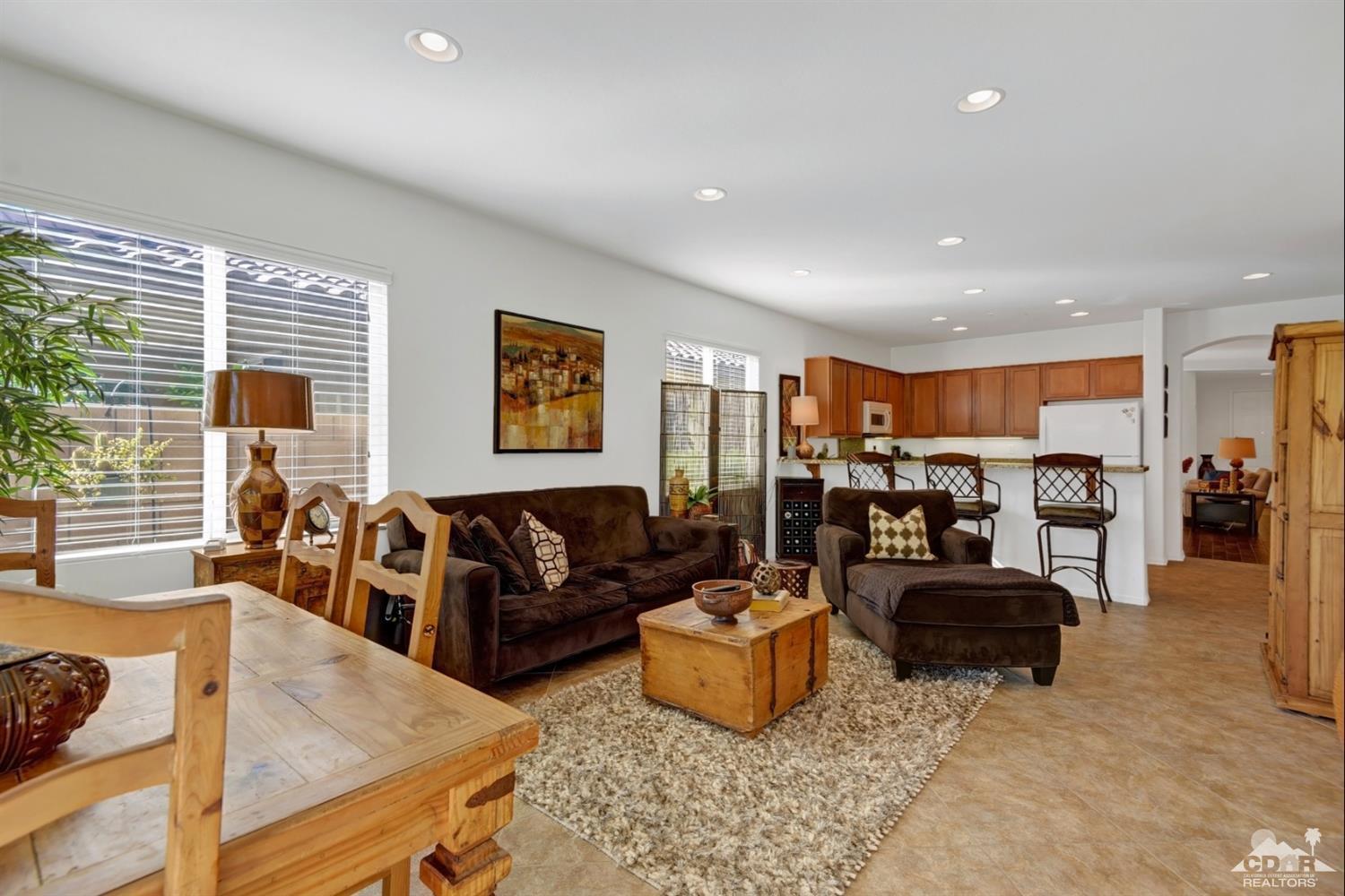 49568 Minelli Street Indio, CA 92201 - Photo 12 of 29 a living room with furniture and a large window