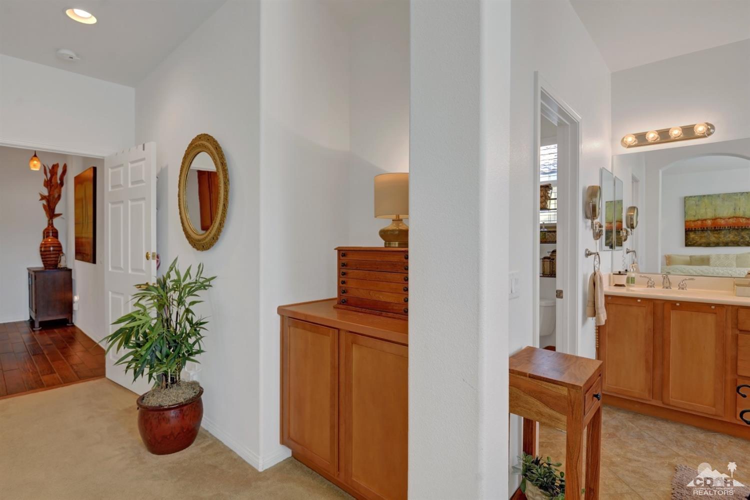 49568 Minelli Street Indio, CA 92201 - Photo 20 of 29 a view of living room filled with furniture and a potted plant