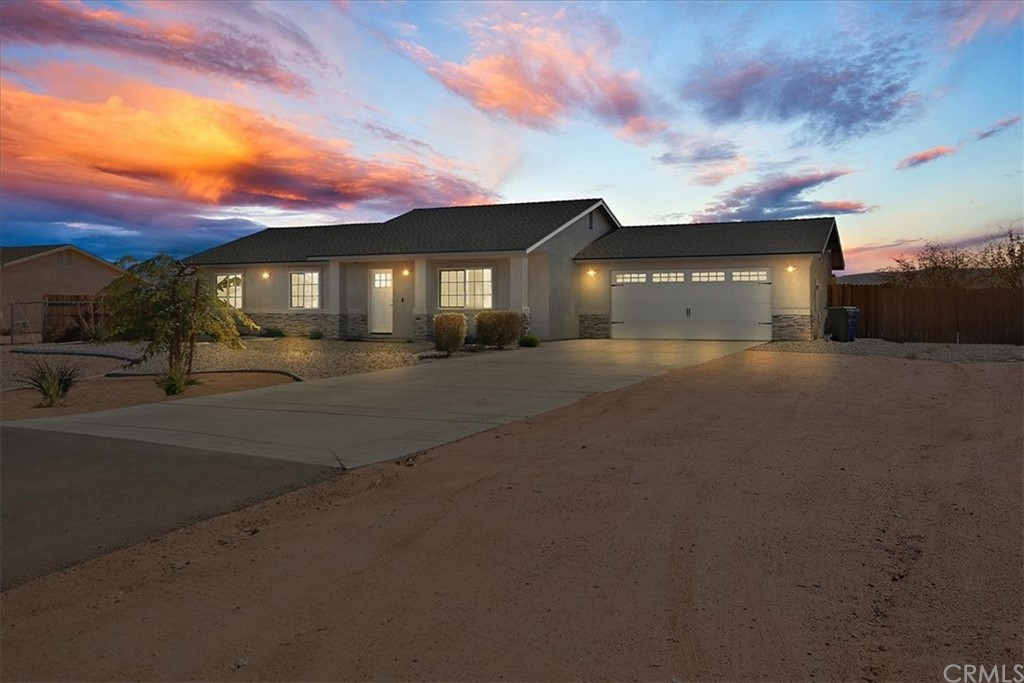 22701 Itasca Road Apple Valley, CA 92308 - Photo 1 of 1 a front view of a house with a yard